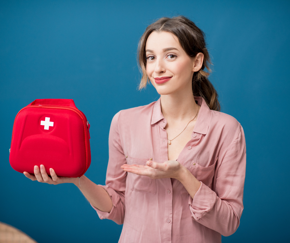 A bride to be holding her wedding day emergency kit.